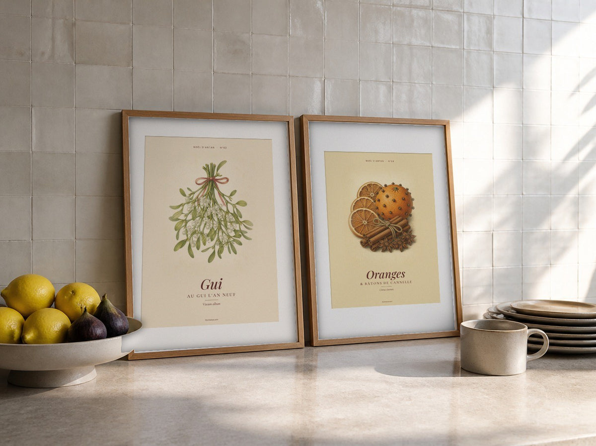 Affiches vintage gui et oranges posées sur un plan de travail